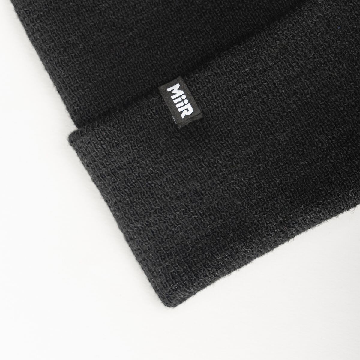 recycled-poly-fine-knit-beanie-d8 WebPDP-RecycledPolyFineKnitBeanie_Studio_TagDetail_Black__BNE005002OS.jpg