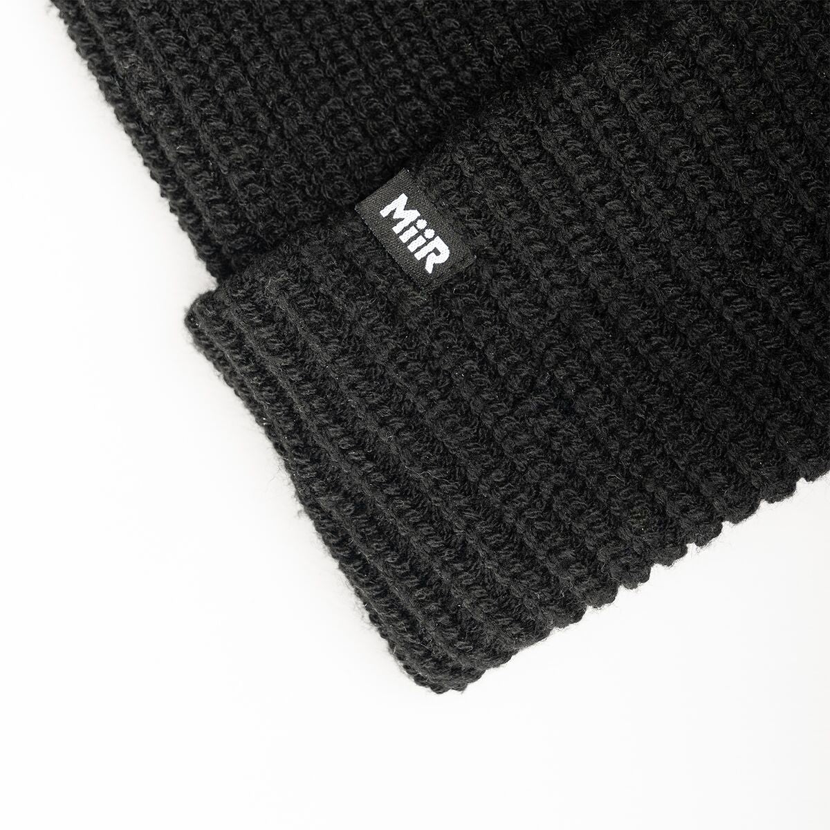 recycled-poly-rib-beanie-e9 WebPDP-RecycledPolyRibBeanie_Studio_TagDetail_Black__BNE002002OS.jpg